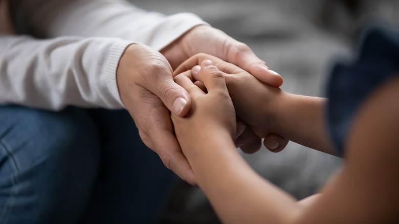 A couple holding hands