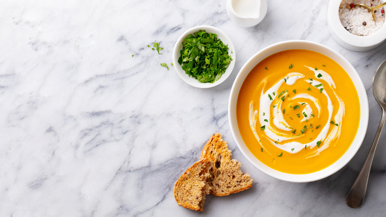 Pumpkin soup on marble counter