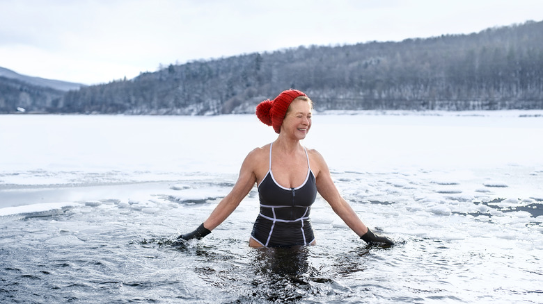 Senior woman in ice-cold water 