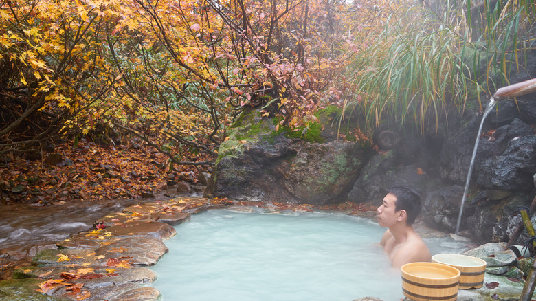 Person in milk bath outside