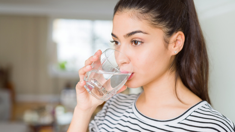 Woman drinking a glass of water