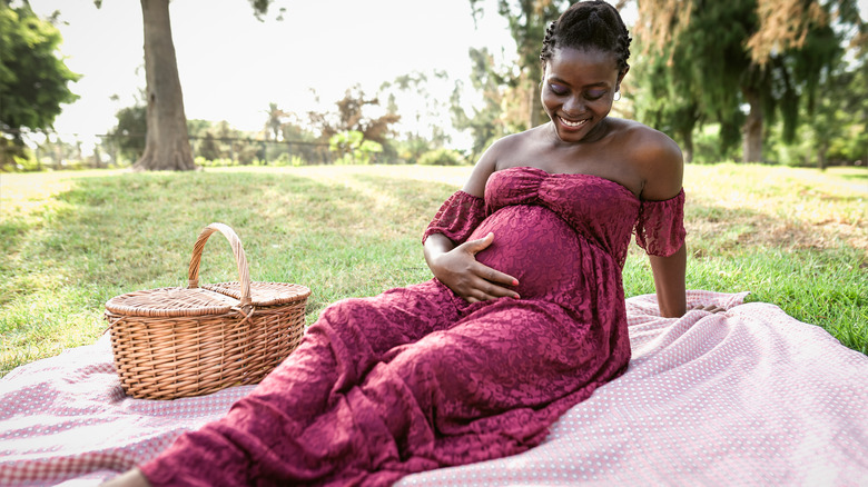 Pregnant woman at picnic