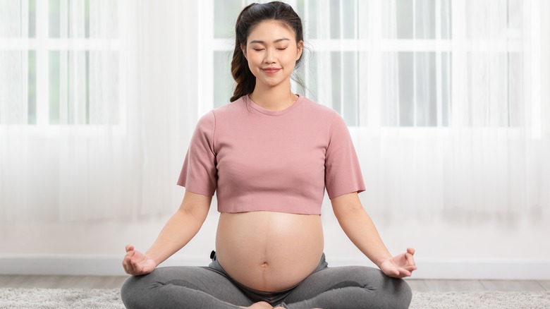 pregnant woman practicing yoga