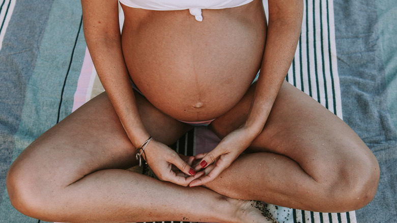 Pregnant woman at beach