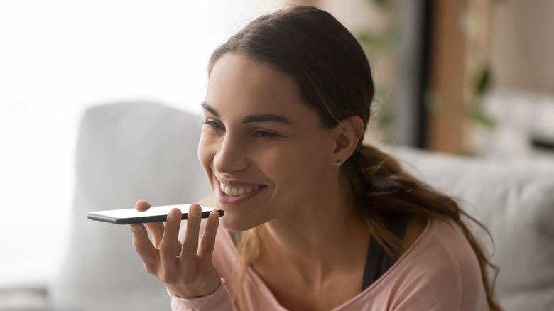 Smiling woman talking on phone