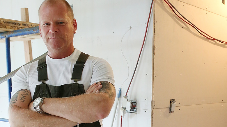 Mike Holmes crossing arms