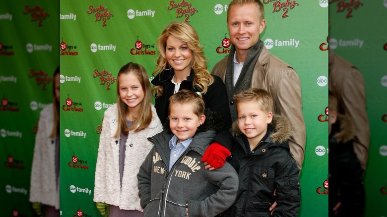 Valeri Bure and Candace Cameron Bure with their kids on red carpet