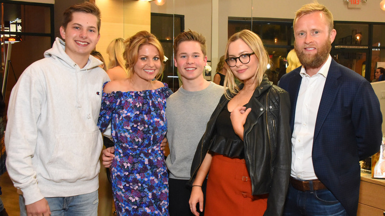 Valeri Bure and Candace Cameron Bure with their kids at event