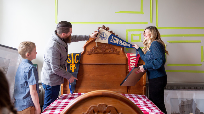 Candis and Andy Meredith with antique bed