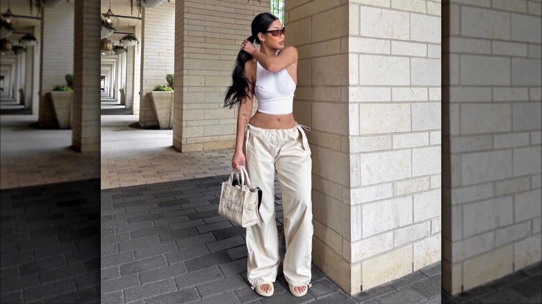 Woman wearing cargo pants and slides