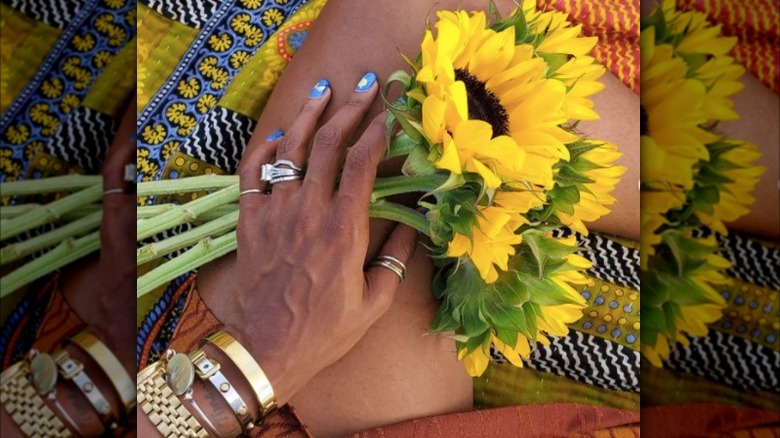 Carmeon Hamilton holding sunflowers 