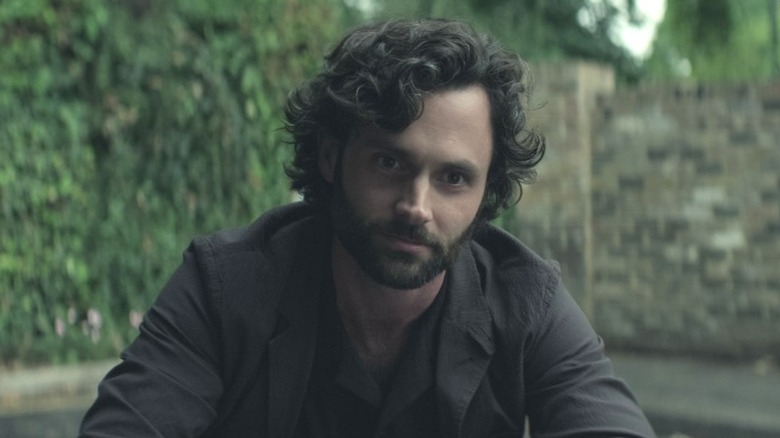 Penn Badgley as Joe Goldberg staring