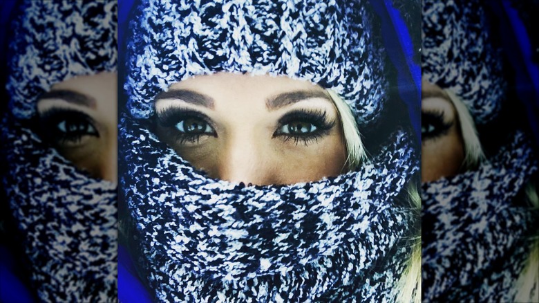 Carrie Underwood covering her face with a scarf