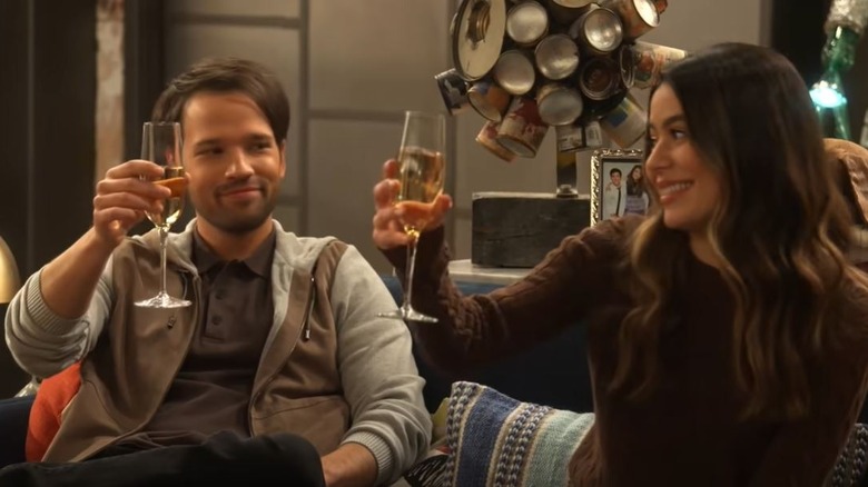 Miranda Cosgrove and Nathan Kress toasting on iCarly