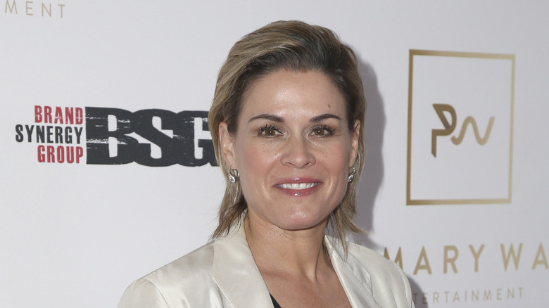 Cat Cora in front of display