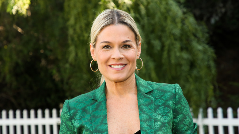 Cat Cora in a green jacket