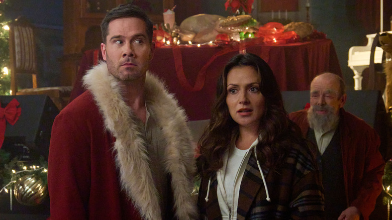 Luke Macfarlane and Italia Ricci in Catch Me If You Claus"