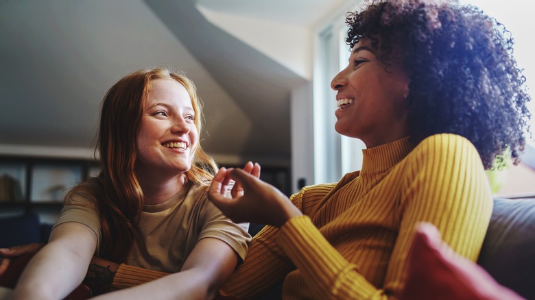 Two friends laughing together