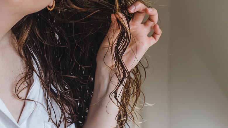 Woman holding lock of hair