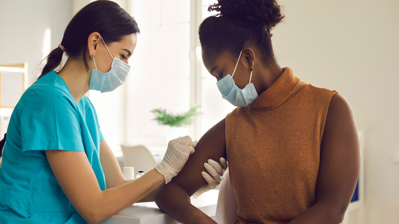 woman getting vaccine