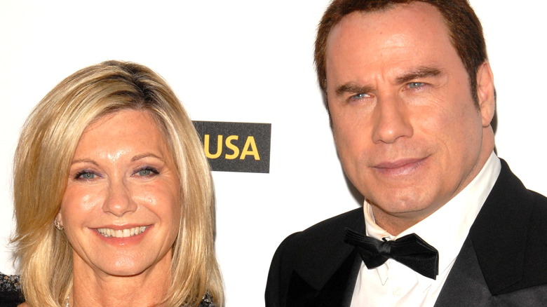 Olivia Newton-John and John Travolta smiling 