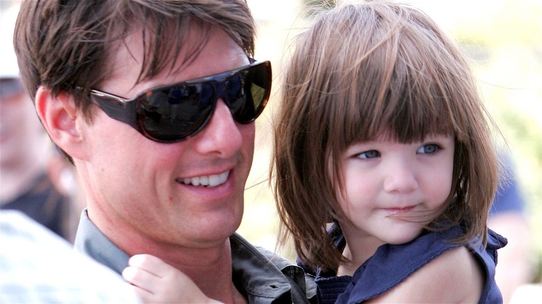 Tom Cruise holding Suri