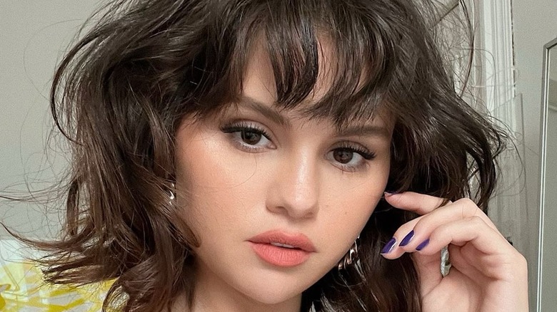 Selena Gomez with short wavy hair and fringe