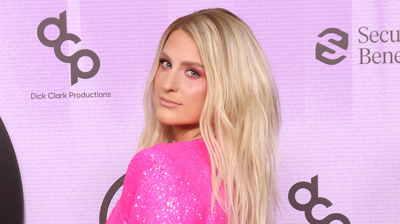 Meghan Trainor posing in a pink sparkly gown 