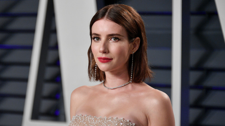Emma Roberts poses at an event