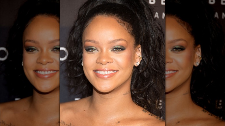 Rihanna smiling at event