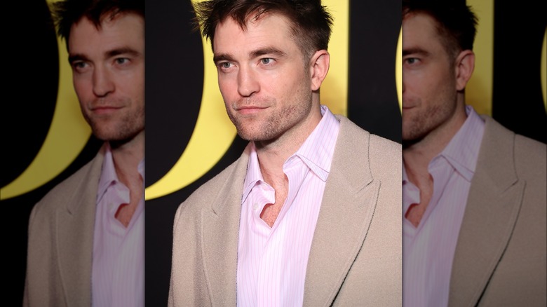 Robert Pattinson smiling at event