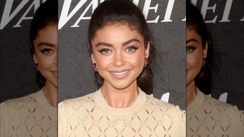 Sarah Hyland smiling at event