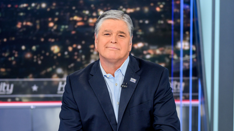 Sean Hannity sitting on set