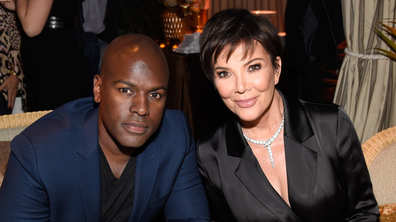 Corey Gamble and Kris Jenner smiling at an event