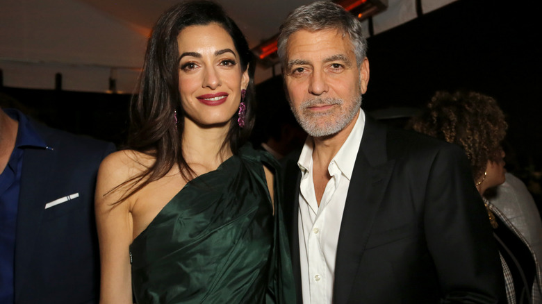 George and Amal Clooney posing