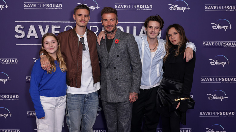 David and Victoria Beckham posing with children