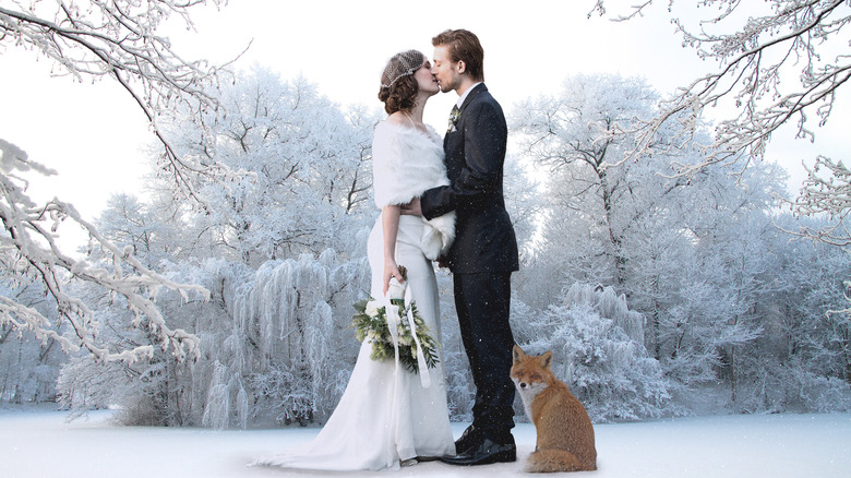 Bride and groom kissing