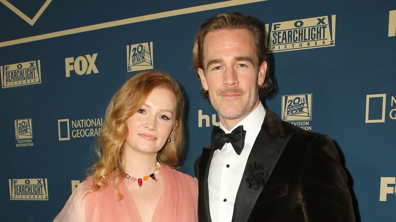 James Van Der Beek and his wife Kimberly pose for a photo. 