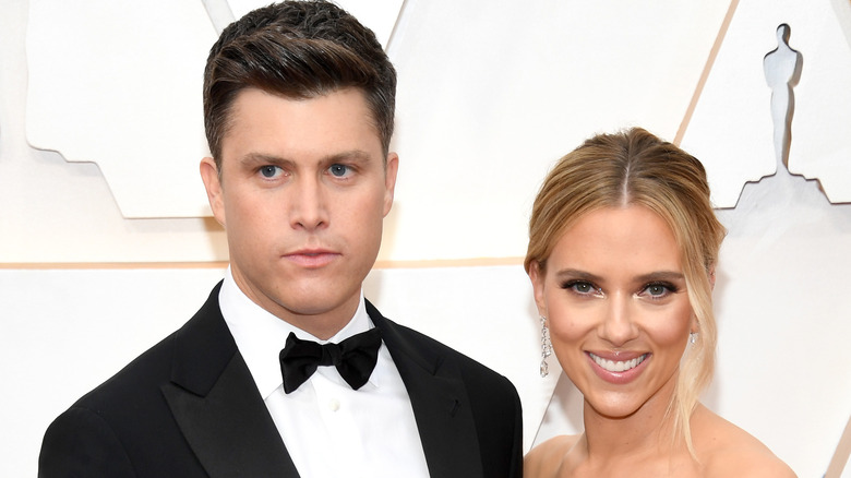 Scarlett Johansson and Colin Jost at an event. 