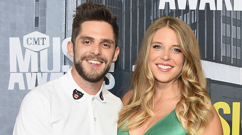 Thomas Rhett and his pregnant wife. 