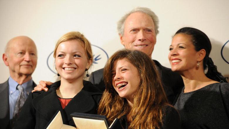 Clint Eastwood poses with his daughters Francesca and Morgan, his wife Dina, and Gilles Jacob