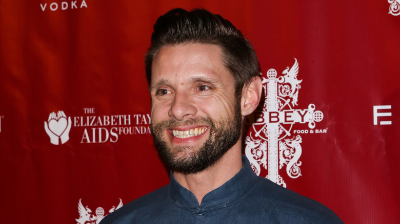 Danny Pintauro smiles at a tree lighting event