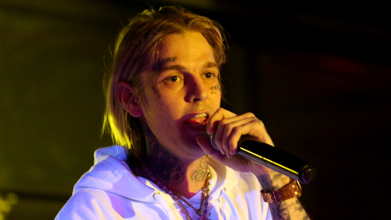 Aaron Carter holding a microphone 