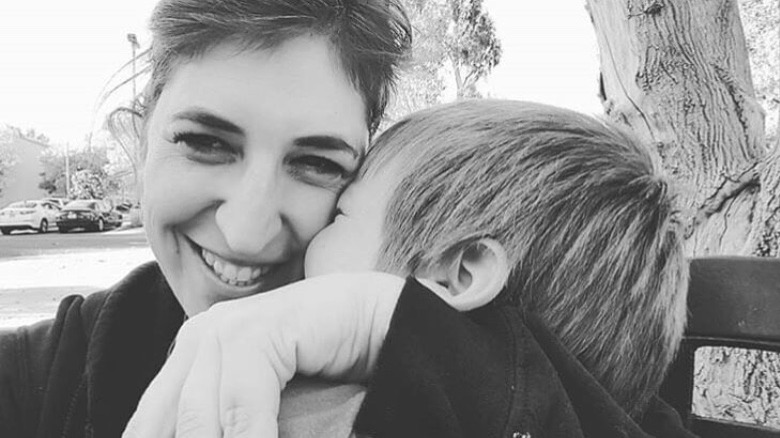 Mayim Bialik hugging her kid