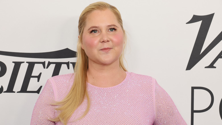 Amy Schumer in a baby pink outfit