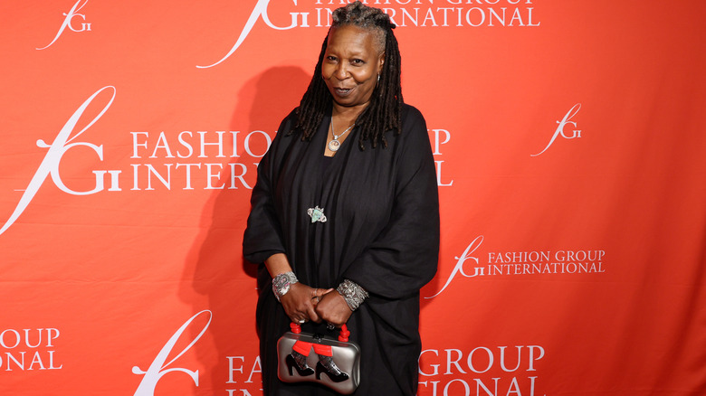 Whoopi Goldberg against orange background