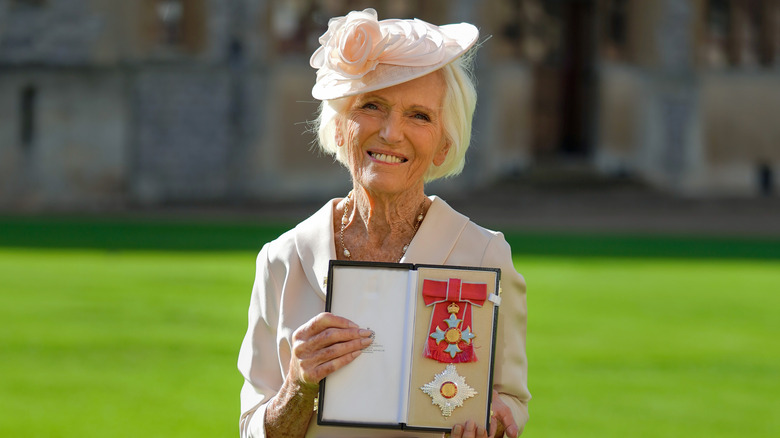 Mary Berry poses with her medal and star