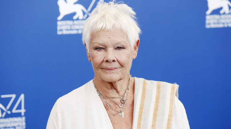 Judi Dench smiles for a photo