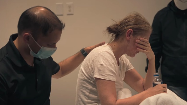 Celine Dion sits with head in hands