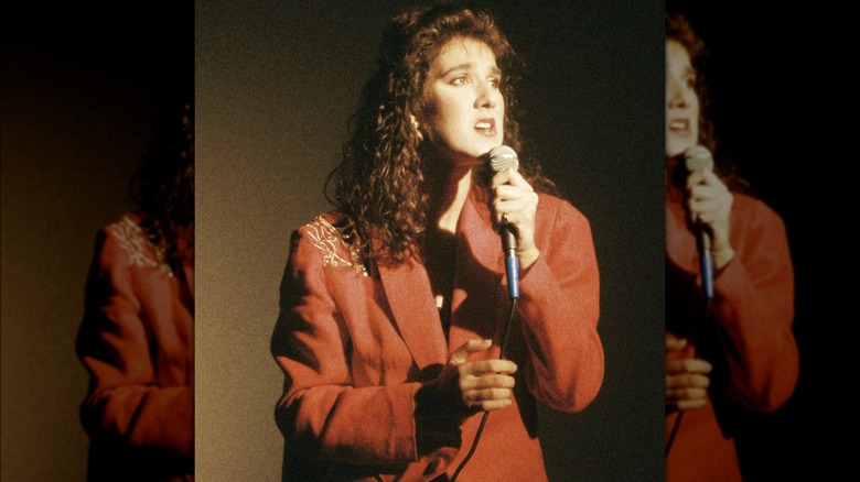 Celine Dion singing into a microphone 